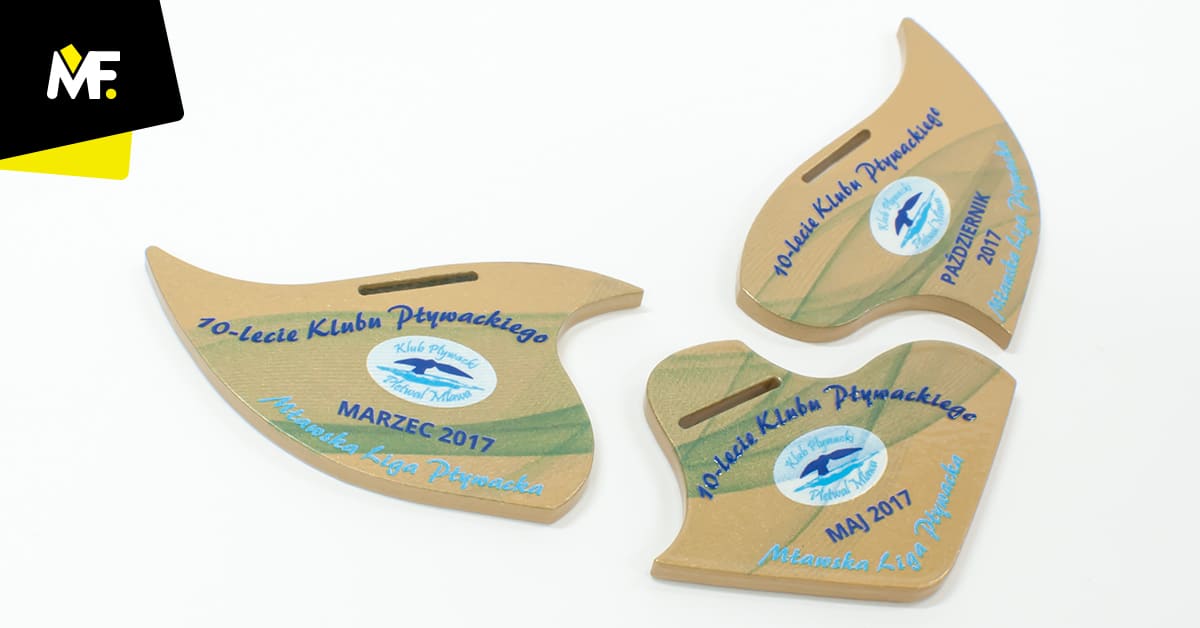 Medale sportowe jubilueszowe 10-lecie Klubu Pływackiego, w formie puzzli